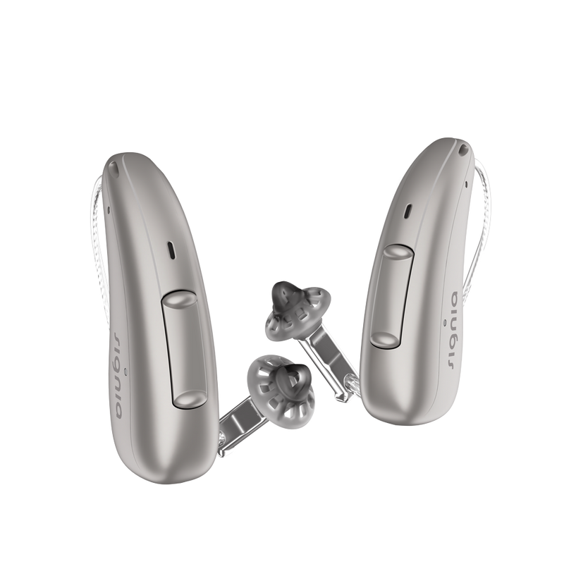 A pair of discreet champagne Signia Charge and Go 3AX 7AX hearing aids profile