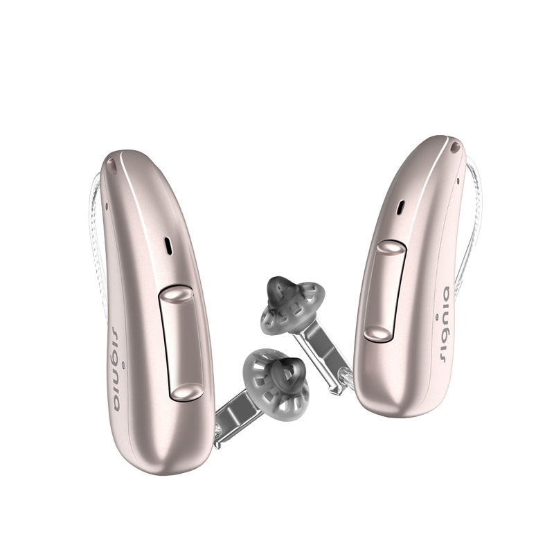 A pair of discreet Rose Gold Signia Charge and Go 3AX 7AX hearing aids profil