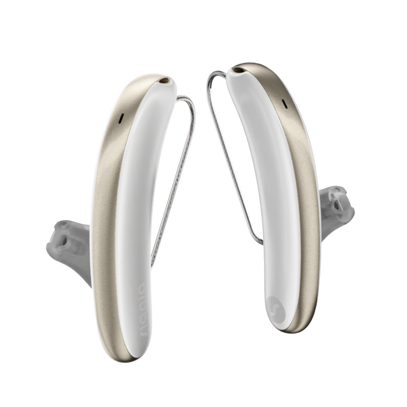 A pair of white and gold aesthetic Signia Styletto 3AX hearing aids
