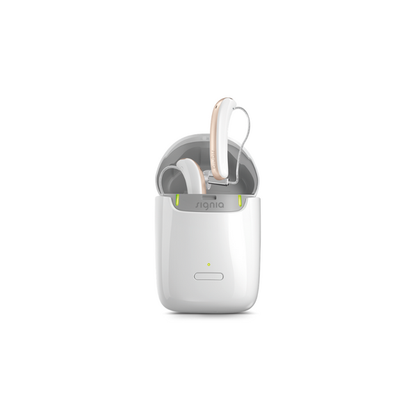White pockets-sized portable nomad charger with white and rose Signia Styletto 3X/7X hearings aids plugged in